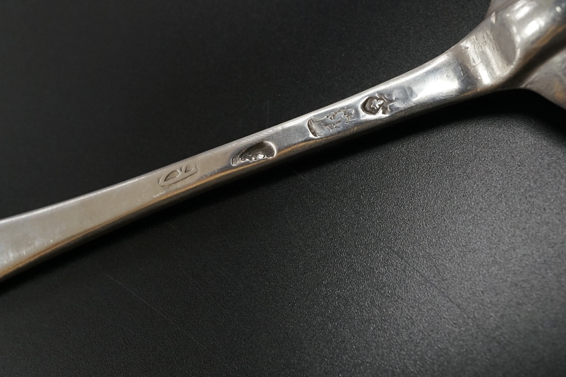 A Queen Anne Britannia standard silver dog nose spoon, indistinct maker's mark, London, 1704, with rat-tail bowl and later? engraved crest, 19.8cm, 63 grams.